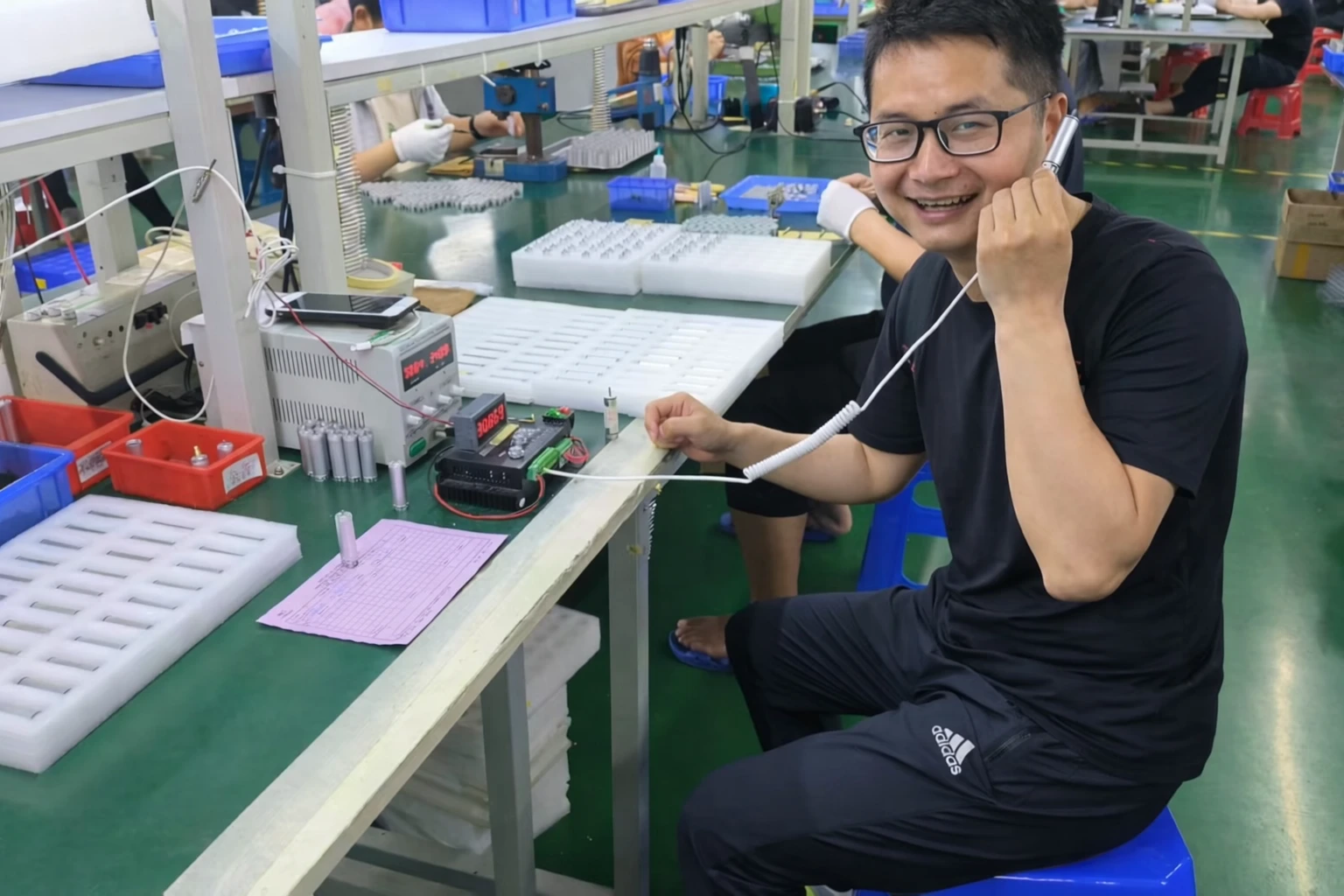 Engineer performing dental motor inspection on production line for OEM manufacturing
